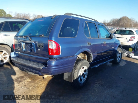 2004 Isuzu Rodeo S with VIN 4S2CK58W444314265, listed as a IAAI auction lot 41294636 with 291,080 mi miles and . Bid and sale history available at DreamBid. Image 4.