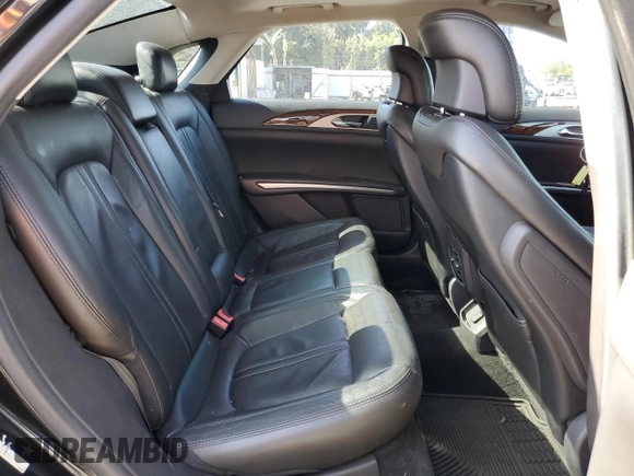 2014 Lincoln MKZ z VIN 3LN6L2GK0ER800286, wystawiony jako Copart lot #57644645 z przebiegiem 130 880 mil mil oraz Szkoda całkowita • Salvage title. Historia ofert i sprzedaży dostępna na DreamBid. Obrazek 10.