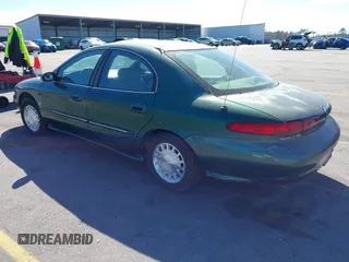 1999 Mercury Sable LS z VIN 1MEFM53S7XA612899, wystawiony jako IAAI lot #41687188 z przebiegiem 155 128 mil mil oraz . Historia ofert i sprzedaży dostępna na DreamBid. Obrazek 3.