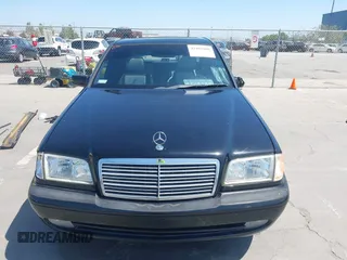 1999 Mercedes-Benz C with VIN WDBHA33G3XF889442, listed as a IAAI auction lot 42403800 with 82,075 mi miles and . Bid and sale history available at DreamBid. Image 12.