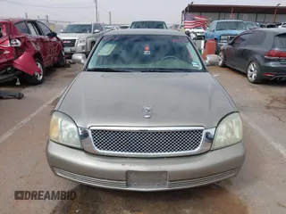 2003 Cadillac DeVille z VIN 1G6KD54Y63U223640, wystawiony jako IAAI lot #41704549 z przebiegiem 127 981 mil mil oraz . Historia ofert i sprzedaży dostępna na DreamBid. Obrazek 12.