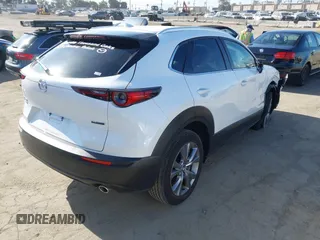 2024 Mazda CX-30 S Premium with VIN 3MVDMBDM4RM616159, listed as a IAAI auction lot 42328334 with 4,614 mi miles and . Bid and sale history available at DreamBid. Image 4.