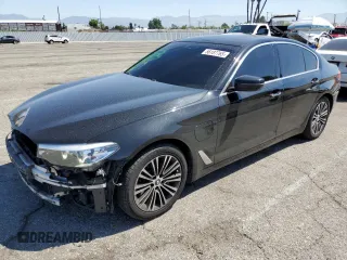 2018 BMW 5 Series 530e xDrive with VIN WBAJB1C58JG624288, listed as a Copart auction lot 56187765 with 64,243 mi miles and Salvage title. Bid and sale history available at DreamBid. Image 1.