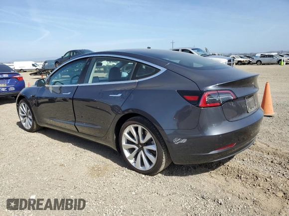 2018 Tesla Model 3 Long Range Battery z VIN 5YJ3E1EB0JF113044, wystawiony jako Copart lot #57056865 z przebiegiem 65 613 mil mil oraz Szkody całkowita. Historia ofert i sprzedaży dostępna na DreamBid. Obrazek 2.