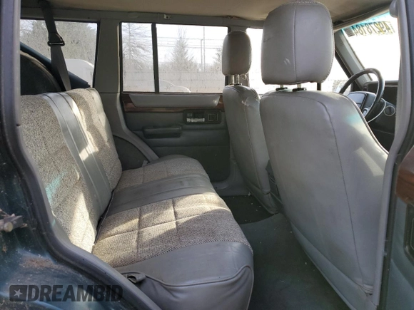 1996 Jeep Cherokee Country with VIN 1J4FJ78S9TL252803, listed as a Copart auction lot 49278184 with 180,420 mi miles and Clean Title. Bid and sale history available at carsss.com. Image 11.