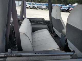 1995 Jeep Wrangler with VIN 1J4FY29SXSP230216, listed as a Copart auction lot 77257834 with 144,217 mi miles and Salvage Title. Bid and sale history available at carsss.com. Image 10.