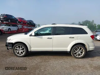 2013 Dodge Journey Crew with VIN 3C4PDCDG0DT591533, listed as a IAAI auction lot 42630548 with 164,961 mi miles and . Bid and sale history available at DreamBid. Image 14.