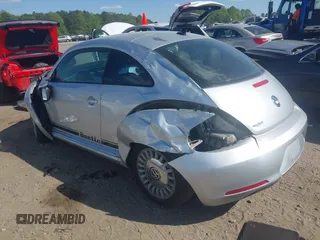 2014 Volkswagen Beetle 2.5L w/Sun with VIN 3VWJP7AT7EM633386, listed as a IAAI auction lot 42060290 with 273,374 mi miles and . Bid and sale history available at DreamBid. Image 3.