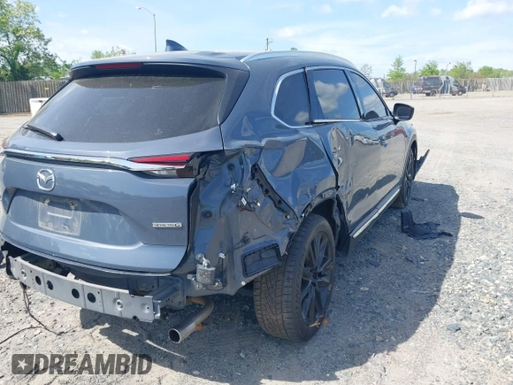 2022 Mazda CX-9 Grand Touring with VIN JM3TCBDY8N0628886, listed as a IAAI auction lot 42074044 with 67,867 mi miles and . Bid and sale history available at DreamBid. Image 4.