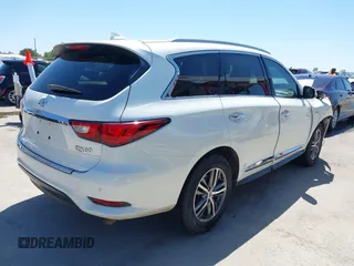 2016 Infiniti QX60 with VIN 5N1AL0MMXGC511972, listed as a IAAI auction lot 41979787 with 127,298 mi miles and . Bid and sale history available at DreamBid. Image 4.