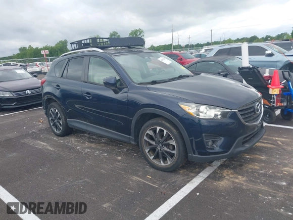 2016 Mazda CX-5 Grand Touring with VIN JM3KE2DYXG0890174, listed as a IAAI auction lot 42157884 with 141,873 mi miles. Bid and sale history available at carsss.com. Image 1.