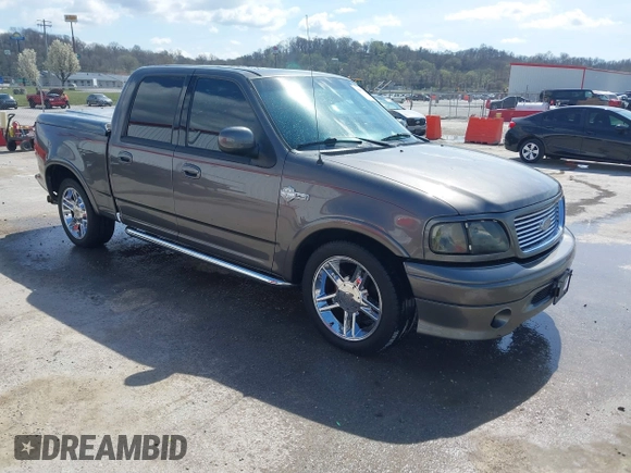 2002 Ford F-150 Harley Davidson with VIN 1FTRW07392KE11409, listed as a IAAI auction lot 41877998 with 148,476 mi miles. Bid and sale history available at carsss.com. Image 1.
