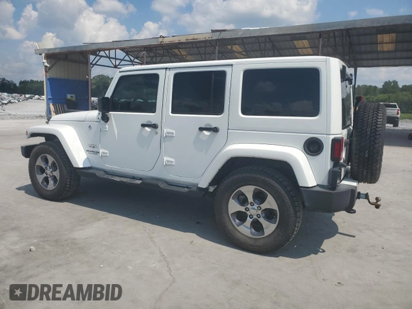 2016 Jeep Wrangler Unlimited Sahara with VIN 1C4BJWEG6GL182794, listed as a Copart auction lot 57880725 with 127,752 mi miles and Salvage title. Bid and sale history available at DreamBid. Image 2.