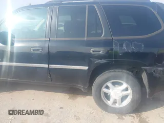 2006 GMC Envoy SLT with VIN 1GKDS13S062234137, listed as a IAAI auction lot 41561864 with 221,031 mi miles. Bid and sale history available at carsss.com. Image 6.