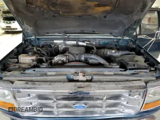 1995 Ford F-350 z VIN 1FTJW35F6SEA60338, wystawiony jako Copart lot #50962515 z przebiegiem 235 177 mil mil oraz Szkoda całkowita • Salvage title. Historia ofert i sprzedaży dostępna na DreamBid. Obrazek 11.