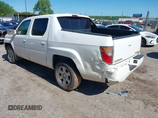 2006 Honda Ridgeline RTL with VIN 2HJYK16506H562857, listed as a IAAI auction lot 42169379 with 154,194 mi miles. Bid and sale history available at carsss.com. Image 3.