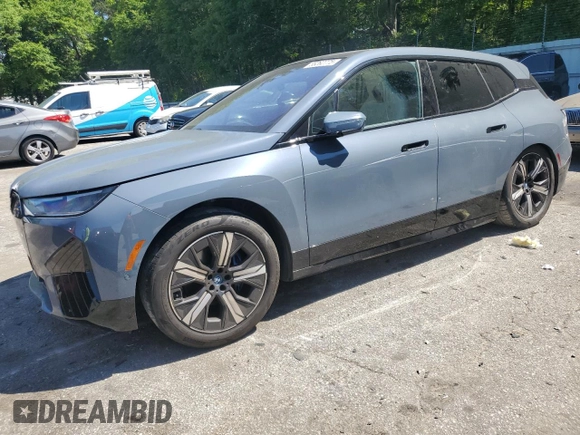 2022 BMW iX xDrive50 с VIN WB523CF00NCK44547, выставлен на аукционе Copart как лот 55262775 с пробегом 22 664 миль миль и Списание • Salvage title. История ставок и продаж доступна на DreamBid. Изображение 1.