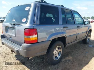 1996 Jeep Grand Cherokee with VIN 1J4EZ58S5TC149533, listed as a IAAI auction lot 42456529 with 173,872 mi miles and . Bid and sale history available at DreamBid. Image 4.
