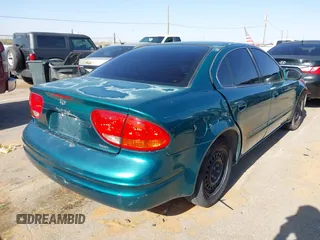 1999 Oldsmobile Alero GL z VIN 1G3NL52T0XC354966, wystawiony jako IAAI lot #42259258 z przebiegiem Nie podano mil oraz . Historia ofert i sprzedaży dostępna na DreamBid. Obrazek 4.