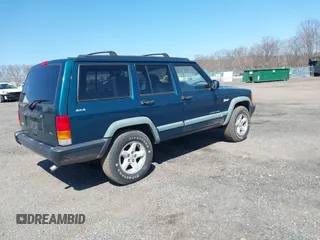 1998 Jeep Cherokee Sport z VIN 1J4FJ68S2WL136129, wystawiony jako IAAI lot #41810918 z przebiegiem 269 989 mil mil oraz . Historia ofert i sprzedaży dostępna na DreamBid. Obrazek 4.