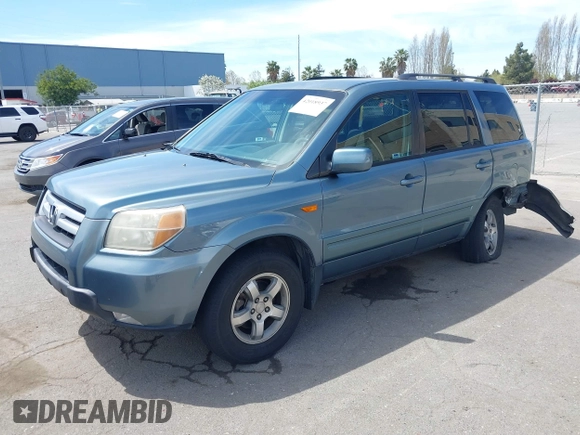 2007 Honda Pilot EX with VIN 2HKYF18447H520522, listed as a IAAI auction lot 42018937 with 128,401 mi miles. Bid and sale history available at carsss.com. Image 2.