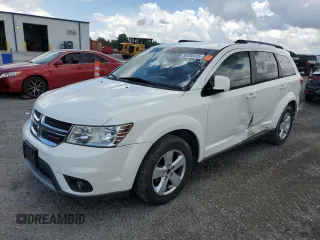 2012 Dodge Journey SXT with VIN 3C4PDCBG5CT135724, listed as a Copart auction lot 56938415 with 180,548 mi miles and Salvage title. Bid and sale history available at DreamBid. Image 1.