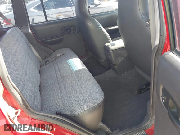 1999 Jeep Cherokee Sport with VIN 1J4FT68S4XL613395, listed as a IAAI auction lot 42316934 with 142,838 mi miles and . Bid and sale history available at DreamBid. Image 8.