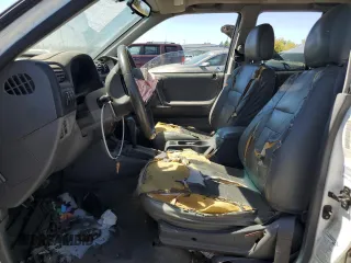 2000 Honda Passport LX с VIN 4S6DM58WXY4410601, выставлен на аукционе Copart как лот 70615964 с пробегом 175 795 миль миль и Списание • Salvage title. История ставок и продаж доступна на DreamBid. Изображение 7.