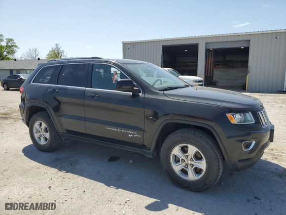 2015 Jeep Grand Cherokee Laredo with VIN 1C4RJFAG9FC905931, listed as a Copart auction lot 52259525 with 131,438 mi miles and Salvage Title. Bid and sale history available at carsss.com. Image 4.