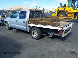 2003 Dodge Dakota SLT with VIN 1D7HL48N33S295059, listed as a IAAI auction lot 42085612 with 176,934 mi miles. Bid and sale history available at carsss.com. Image 3.