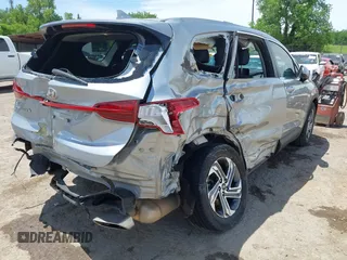 2022 Hyundai Santa Fe SE with VIN 5NMS14AJ7NH393037, listed as a IAAI auction lot 42276818 with 77,656 mi miles and . Bid and sale history available at DreamBid. Image 4.