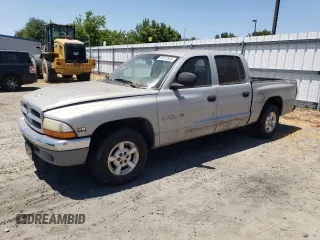 2000 Dodge Dakota Sport z VIN 1B7GL2AN9YS640848, wystawiony jako Copart lot #60572935 z przebiegiem 154 201 mil mil oraz Czysty tytuł • Clean title. Historia ofert i sprzedaży dostępna na DreamBid. Obrazek 1.