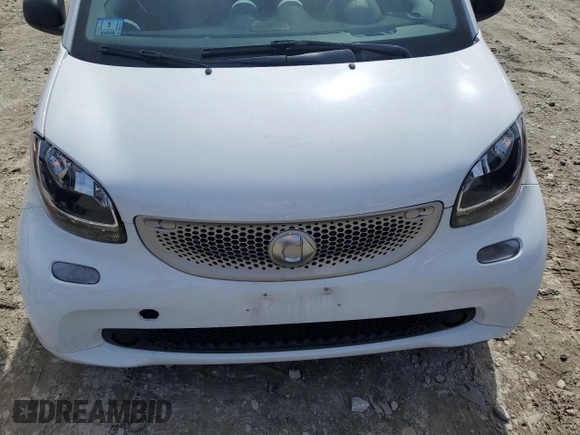 2016 Smart fortwo Passion z VIN WMEFJ5DAXGK123943, wystawiony jako Copart lot #51904865 z przebiegiem 69 821 mil mil oraz Szkody całkowita. Historia ofert i sprzedaży dostępna na DreamBid. Obrazek 11.