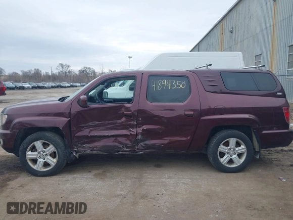 2011 Honda Ridgeline RTL with VIN 5FPYK1F51BB007959, listed as a IAAI auction lot 41894350 with 186,926 mi miles. Bid and sale history available at carsss.com. Image 14.