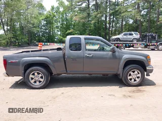 2012 GMC Canyon SLE2 z VIN 1GTJ6PFE2C8128602, wystawiony jako IAAI lot #42421110 z przebiegiem 79 273 mil mil oraz . Historia ofert i sprzedaży dostępna na DreamBid. Obrazek 13.