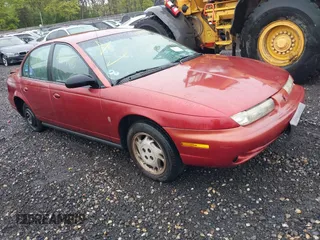 1996 Saturn SL z VIN 1G8ZK5273TZ268401, wystawiony jako IAAI lot #42194239 z przebiegiem Nie podano mil oraz . Historia ofert i sprzedaży dostępna na DreamBid. Obrazek 1.