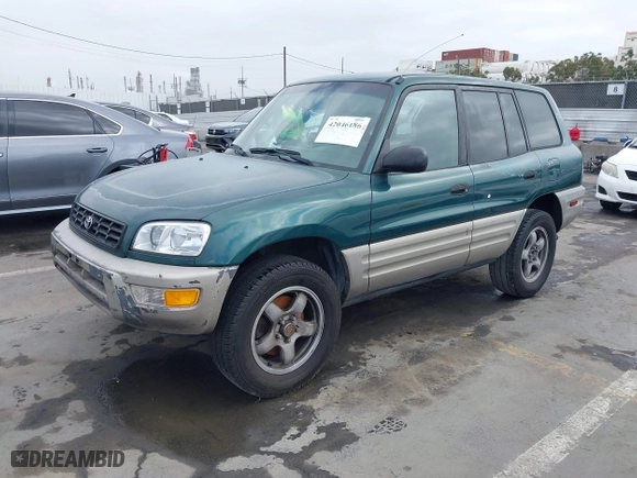 1998 Toyota RAV4 with VIN JT3GP10V9W7032820, listed as a IAAI auction lot 42046186 with 312,888 mi miles. Bid and sale history available at carsss.com. Image 2.
