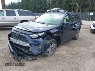 2023 Toyota RAV4 XLE with VIN JTMP1RFV1PD095688, listed as a IAAI auction lot 41874720 with 59,737 mi miles. Bid and sale history available at carsss.com. Image 2.