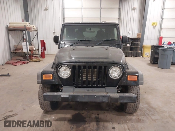 2006 Jeep Wrangler Sport Right Hand Drive with VIN 1J4F449S56P741328, listed as a IAAI auction lot 41476847 with 67,203 mi miles. Bid and sale history available at carsss.com. Image 12.