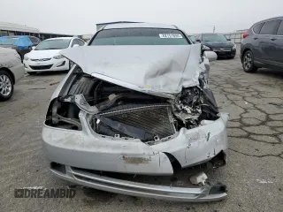 2006 Suzuki Forenza z VIN KL5JD56Z76K411376, wystawiony jako Copart lot #82751694 z przebiegiem Nie podano mil oraz Szkody całkowita. Historia ofert i sprzedaży dostępna na DreamBid. Obrazek 5.