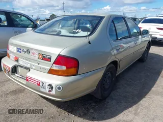 1999 Nissan Altima XE with VIN 1N4DL01D6XC179556, listed as a IAAI auction lot 41783234 with 129,064 mi miles. Bid and sale history available at carsss.com. Image 4.