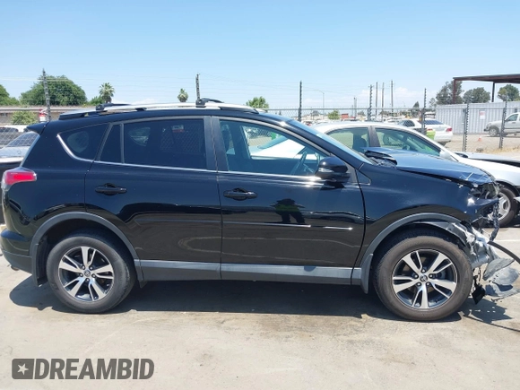 2018 Toyota RAV4 XLE with VIN 2T3WFREV2JW447623, listed as a IAAI auction lot 42410168 with 84,800 mi miles and . Bid and sale history available at DreamBid. Image 13.