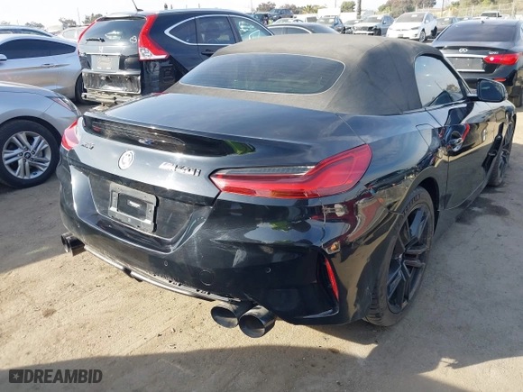 2022 BMW Z4 sDriveM40i with VIN WBAHF9C08NWX38258, listed as a IAAI auction lot 41462157 with 43,534 mi miles. Bid and sale history available at carsss.com. Image 4.