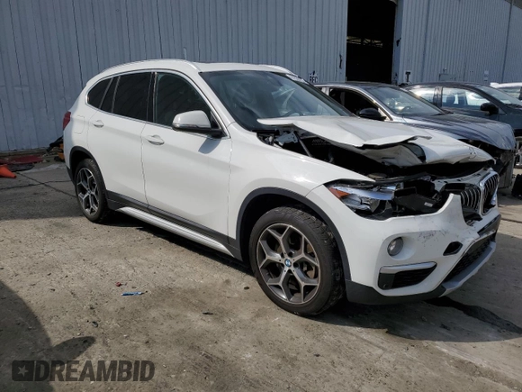 2019 BMW X1 xDrive28i with VIN WBXHT3C59K5L90317, listed as a Copart auction lot 61028125 with 46,789 mi miles and Salvage title. Bid and sale history available at DreamBid. Image 4.