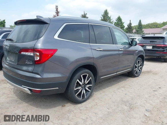 2020 Honda Pilot Elite with VIN 5FNYF6H00LB027472, listed as a IAAI auction lot 42253478 with 69,988 mi miles and . Bid and sale history available at DreamBid. Image 4.