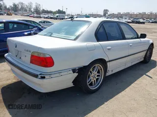2001 BMW 7 Series 740iA with VIN WBAGG83451DN86421, listed as a IAAI auction lot 42104053 with 241,586 mi miles. Bid and sale history available at carsss.com. Image 4.