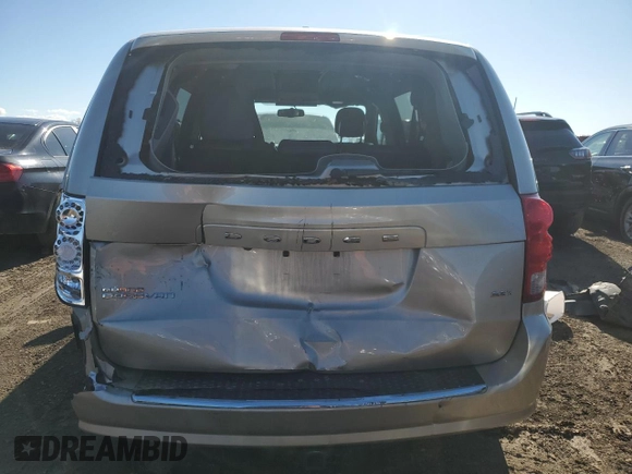 2016 Dodge Grand Caravan SXT with VIN 2C4RDGCG5GR219517, listed as a Copart auction lot 50052405 with 104,552 mi miles and Salvage Title. Bid and sale history available at DreamBid. Image 6.