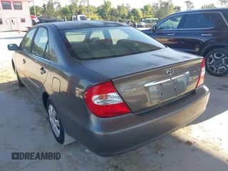 2004 Toyota Camry LE with VIN 4T1BE32KX4U916477, listed as a IAAI auction lot 42018299 with 149,247 mi miles. Bid and sale history available at carsss.com. Image 3.
