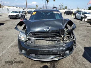 2016 MINI Countryman with VIN WMWZB3C58GWR47074, listed as a Copart auction lot 57174885 with 83,062 mi miles and Salvage title. Bid and sale history available at DreamBid. Image 5.