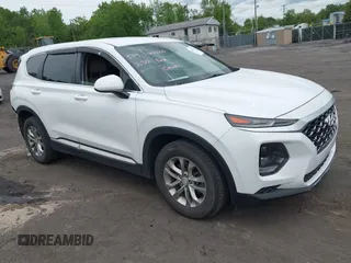 2019 Hyundai Santa Fe SE z VIN 5NMS2CADXKH005960, wystawiony jako IAAI lot #42341142 z przebiegiem 71 617 mil mil oraz . Historia ofert i sprzedaży dostępna na DreamBid. Obrazek 1.